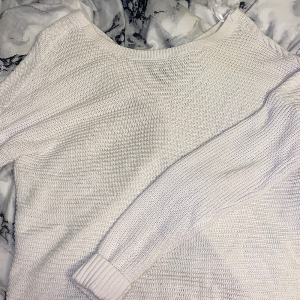 white sweater with knot tie in the back